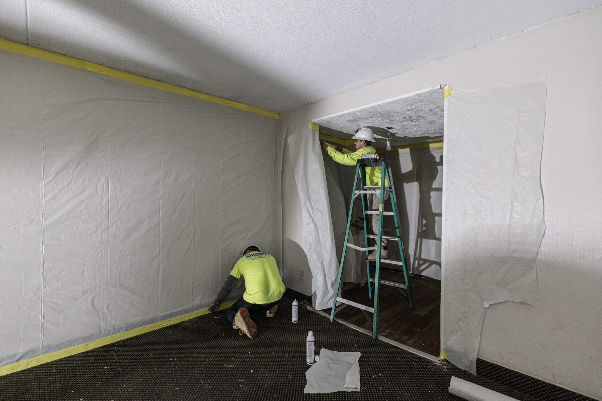 Crew installing containment sheeting in North Tower